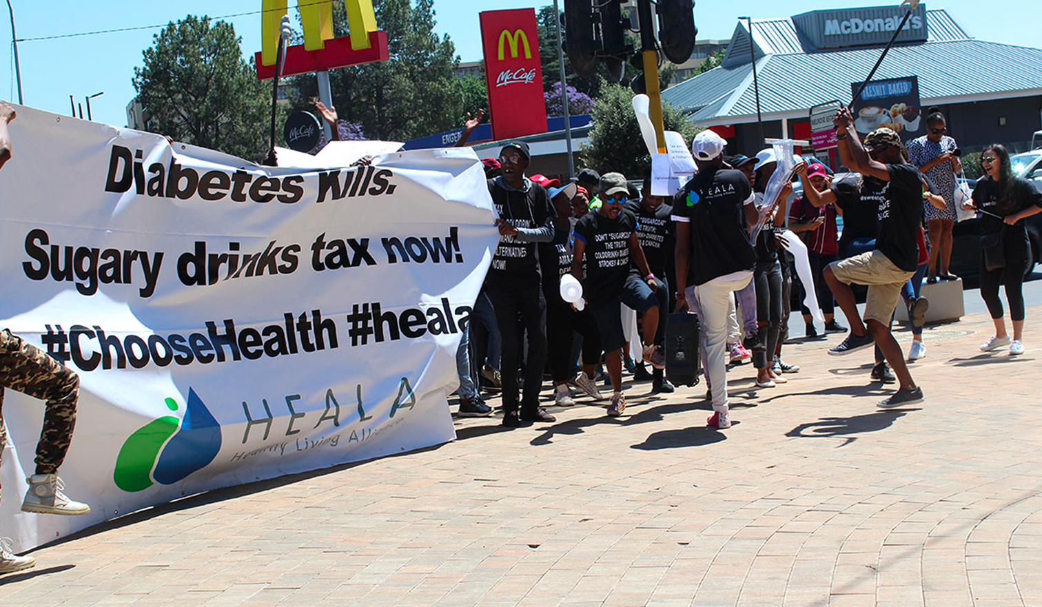 South African partners advocating for a stronger tax during the protests outside McDonalds in Johannesburg. Source: HEALA
